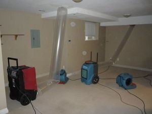 Air Movers and Dehumidifiers In Basement After A Flood