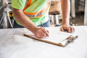 A home reliable restoration expert reviewing a contract 
